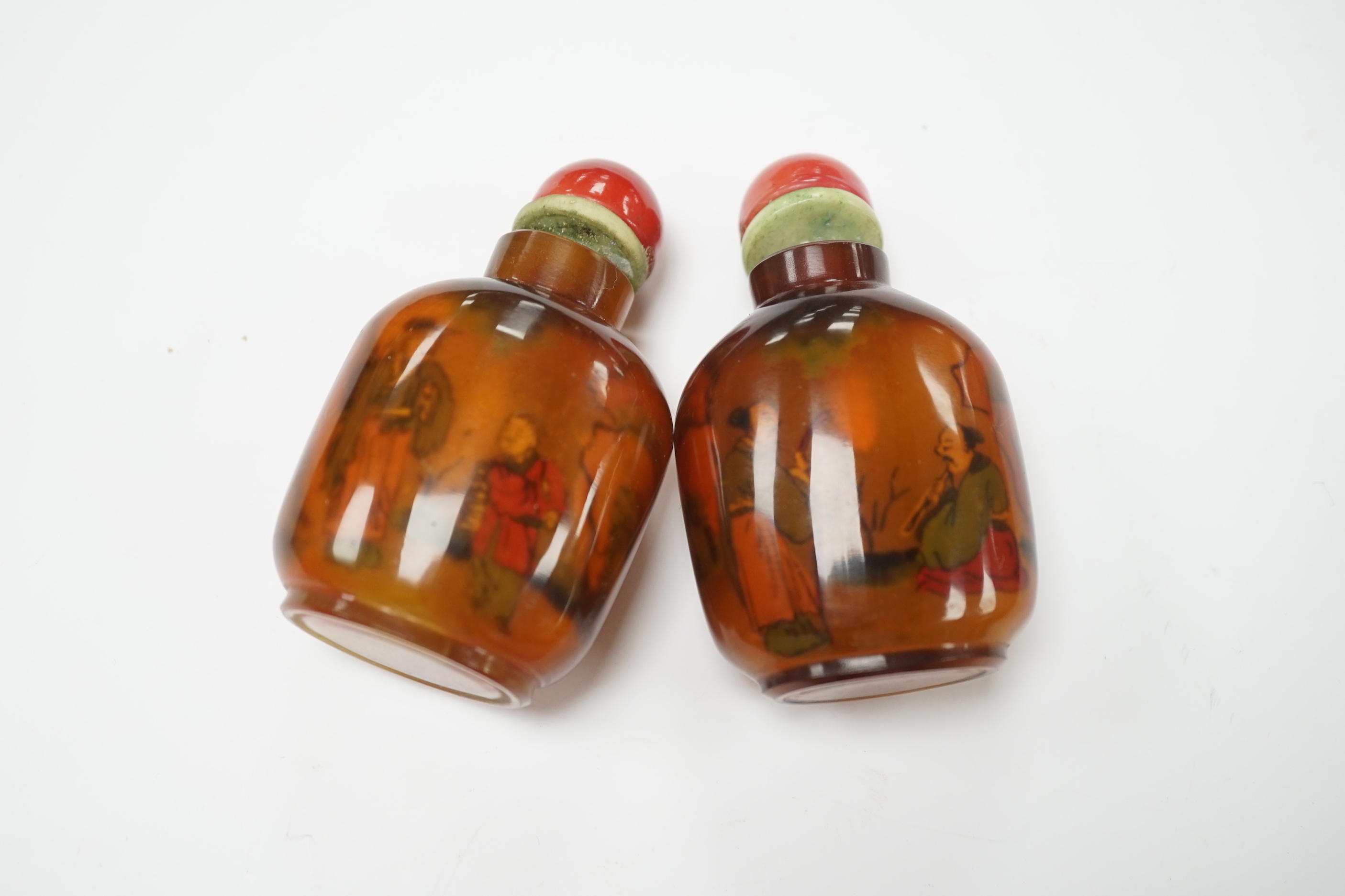 Two Chinese glass snuff bottles, internally painted with figures, 8cm high